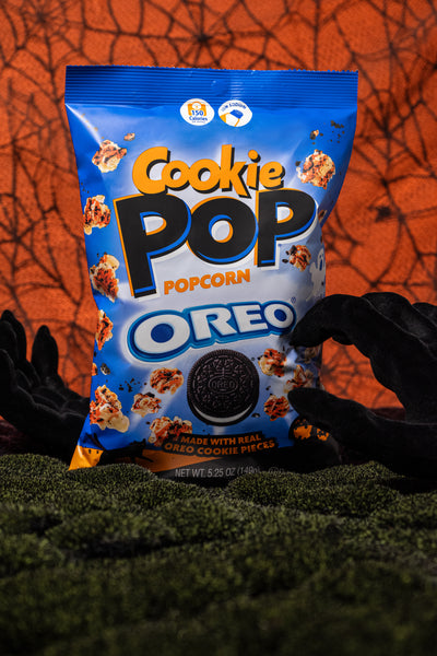 The Flavorful Popcorn Halloween Edition, Made With Real Cookie Pieces and Topped With Orange Drizzle Is currently Available Nationwide in 5.25oz Size Bags